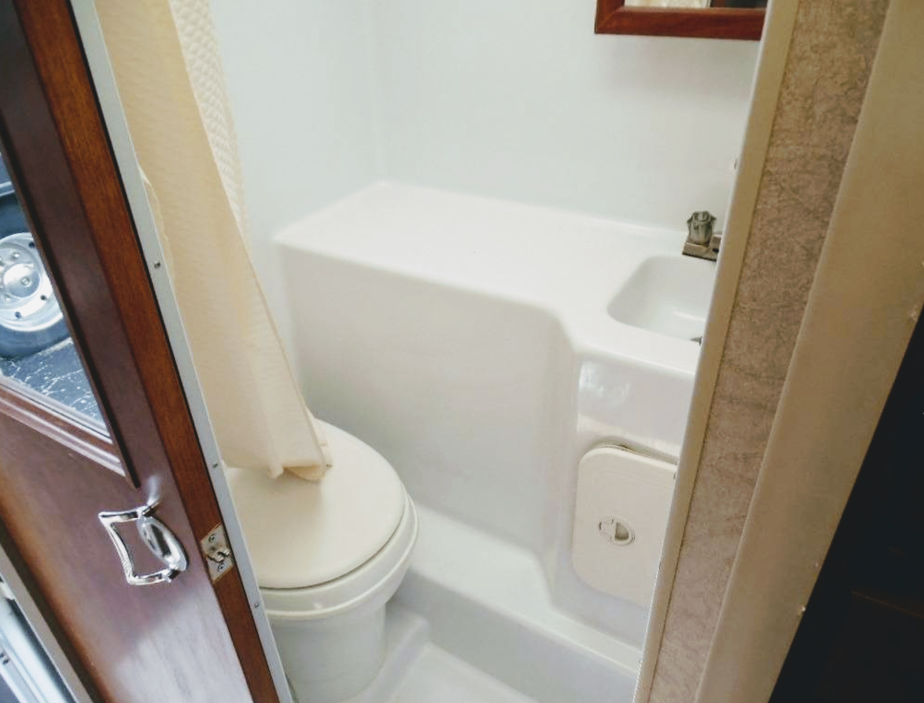 Small RV shower over toilet