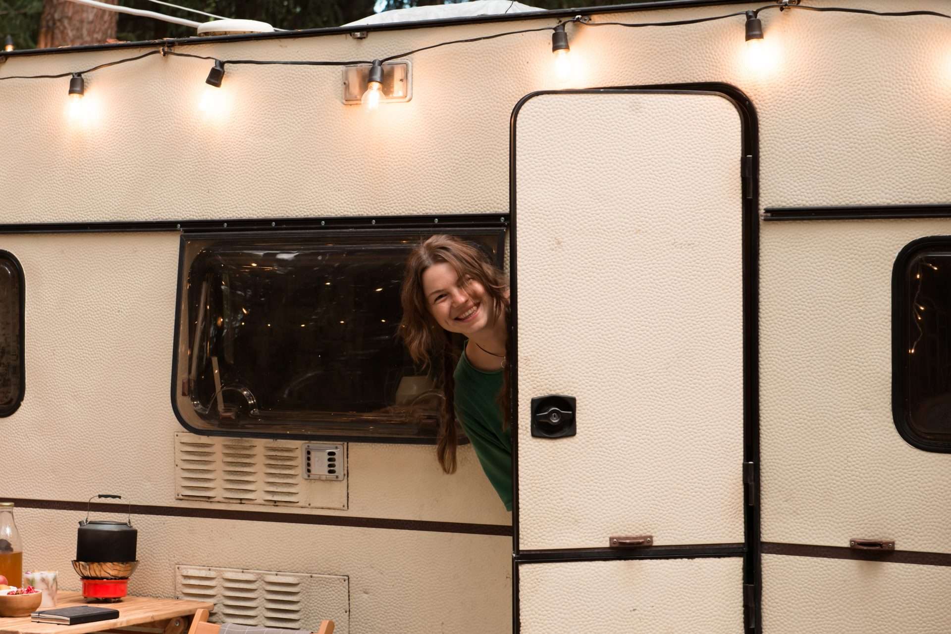 Woman smiling out RV door