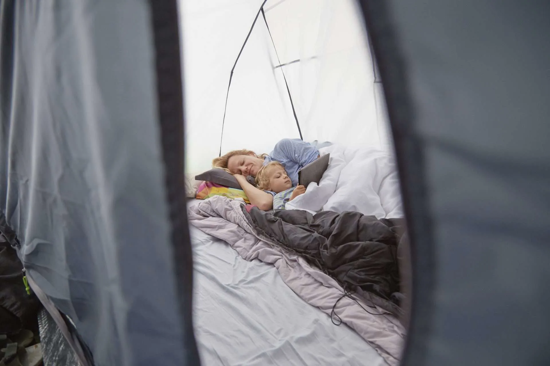 Mother and son using Nemo Tensor Insulated Sleeping Pad while camping