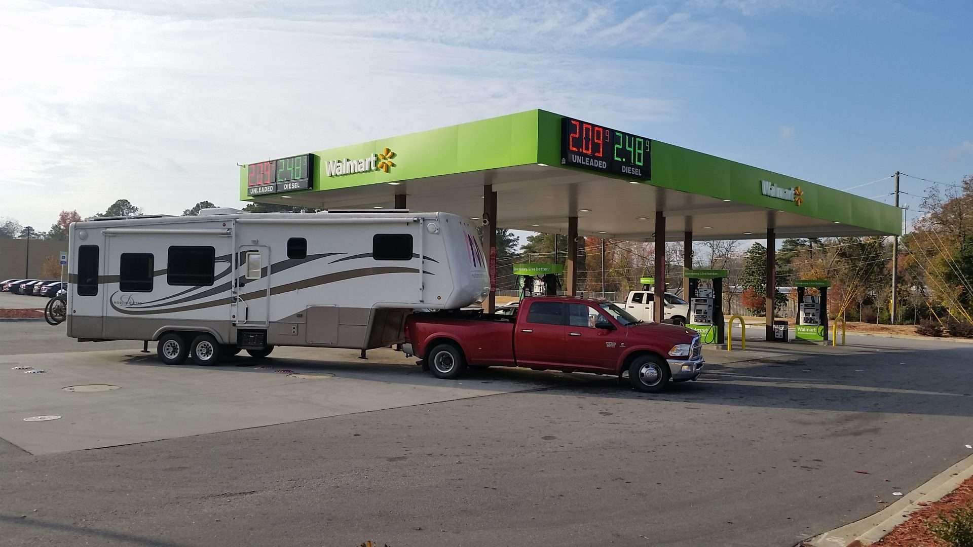 Truck hitched to RV parked at Walmart gas station