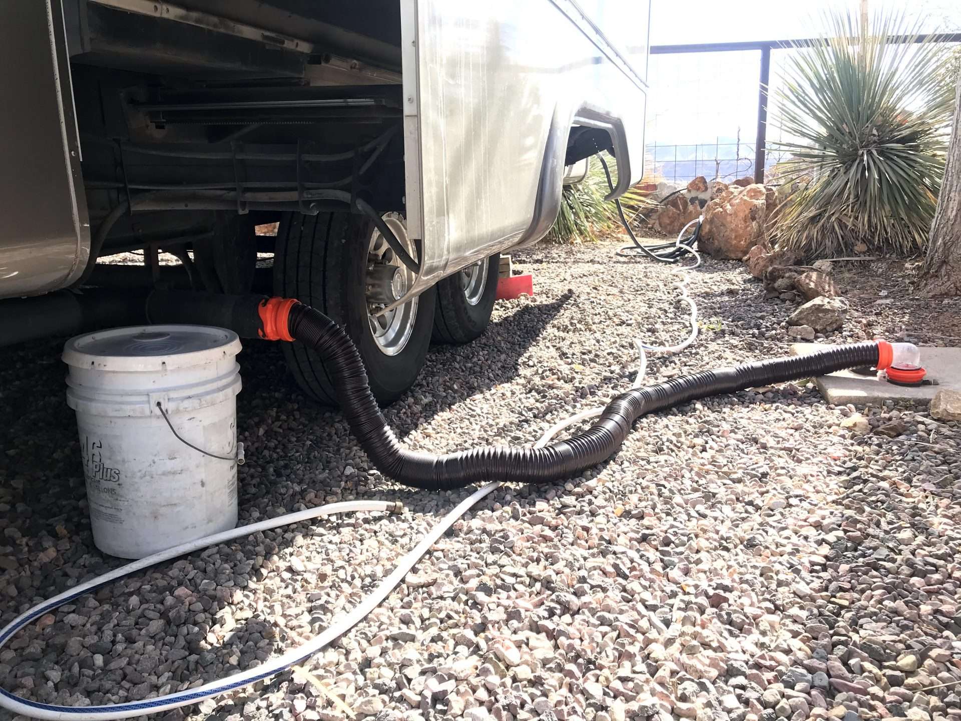 RV sewer hose connected to dump station