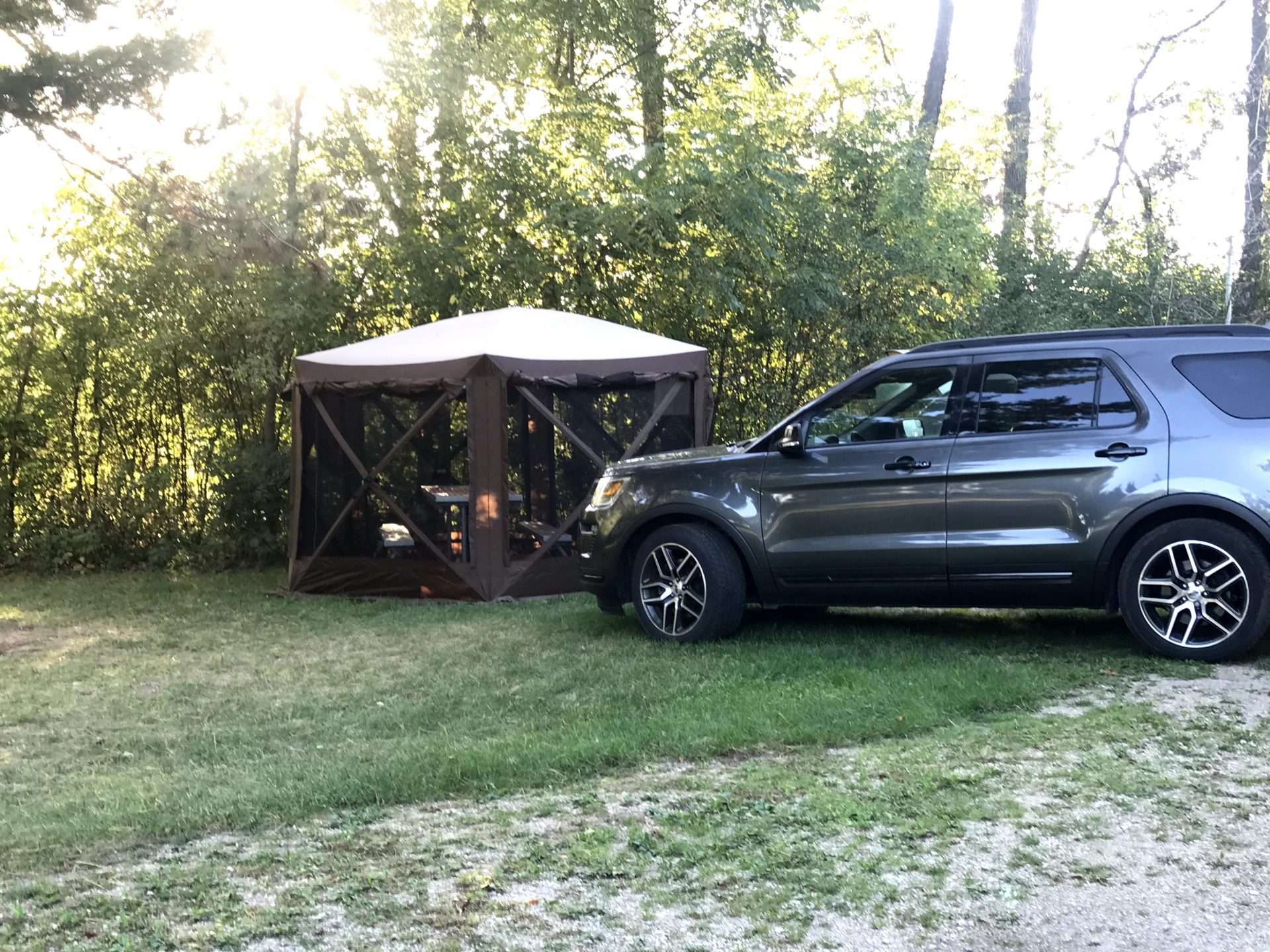 SUV parked next to drive-away awning