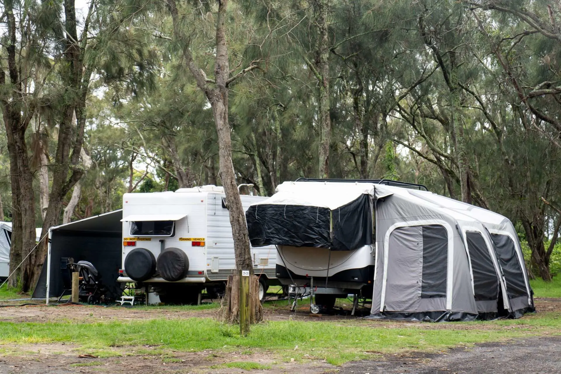 RV awnings open in rainy weather