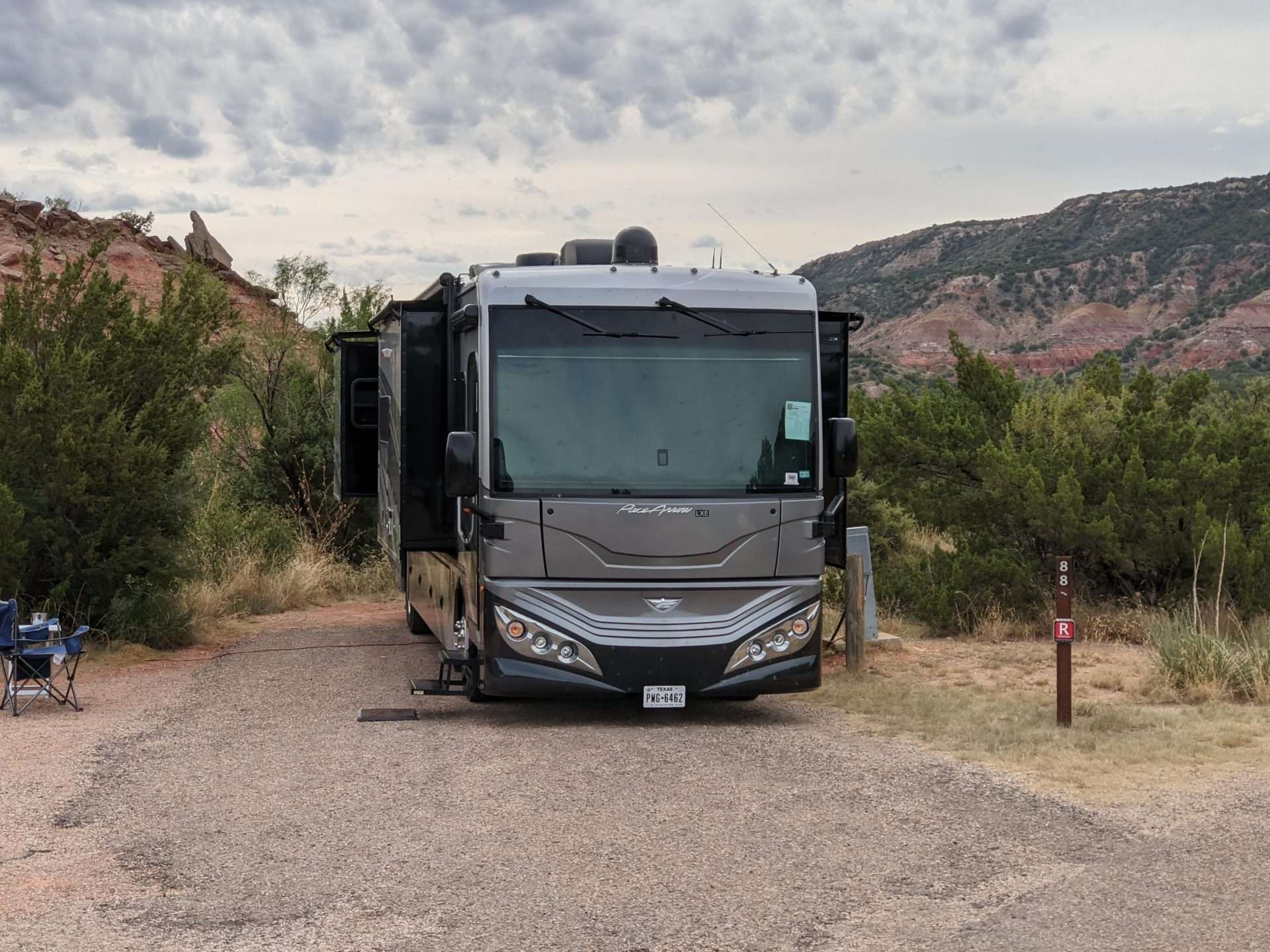 Class C RV parked in campsite