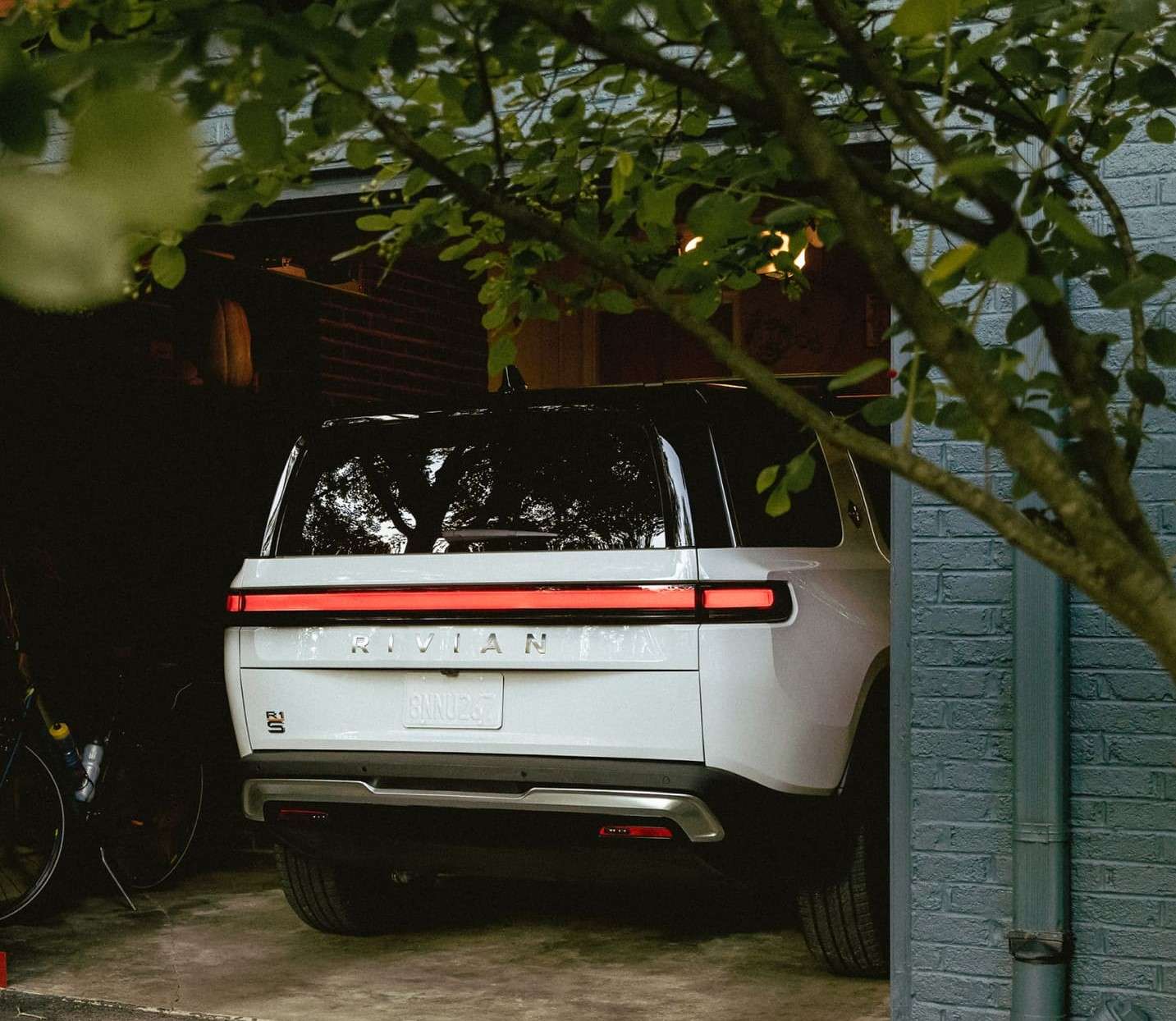 Rivian electric vehicle parked in garage