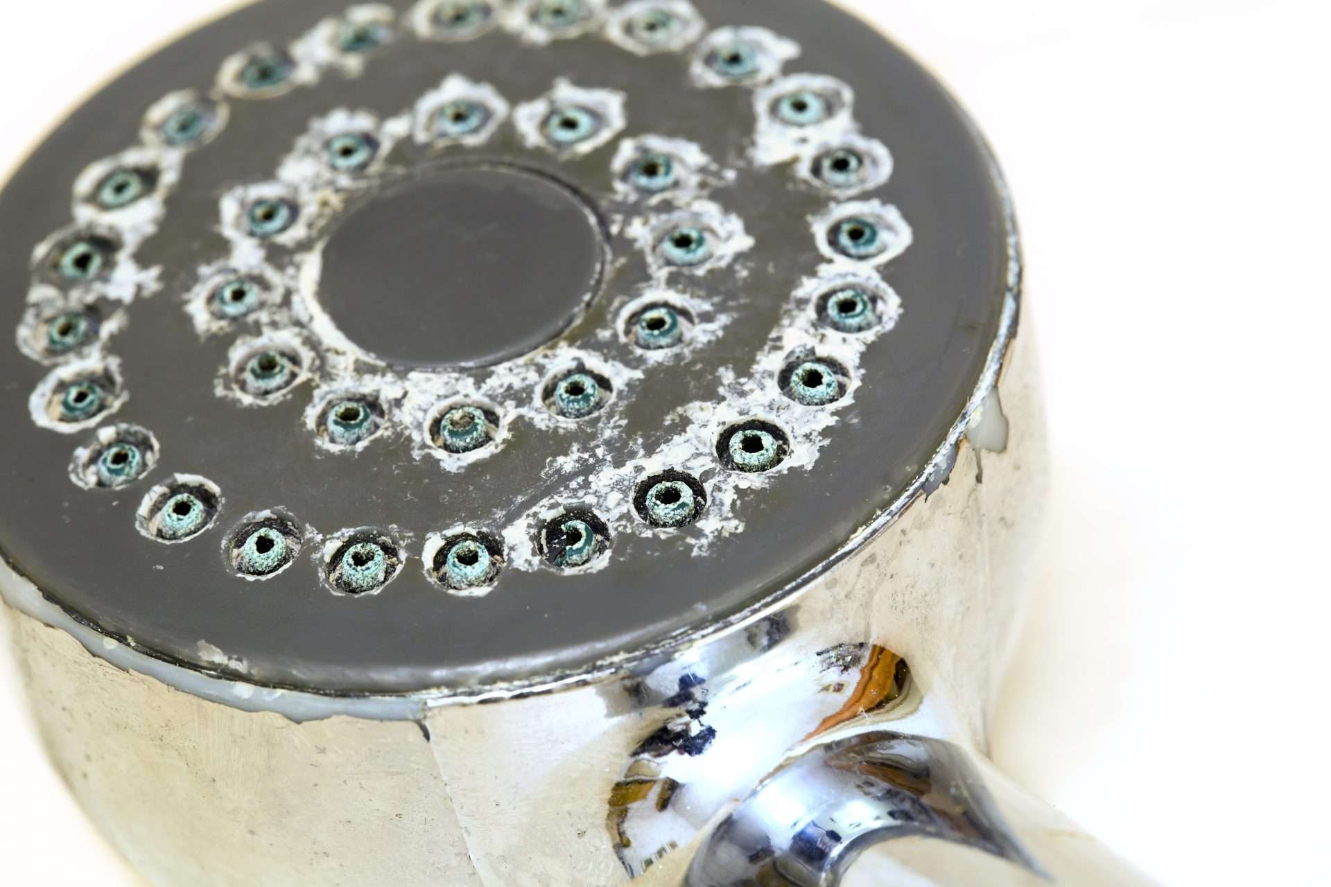 Close up of shower head with limescale