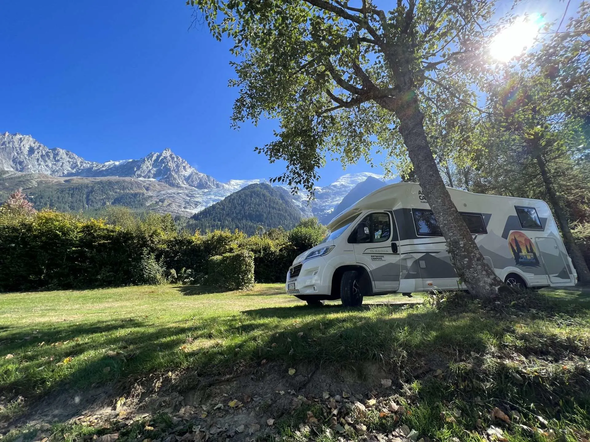 RV parked next to European mountain
