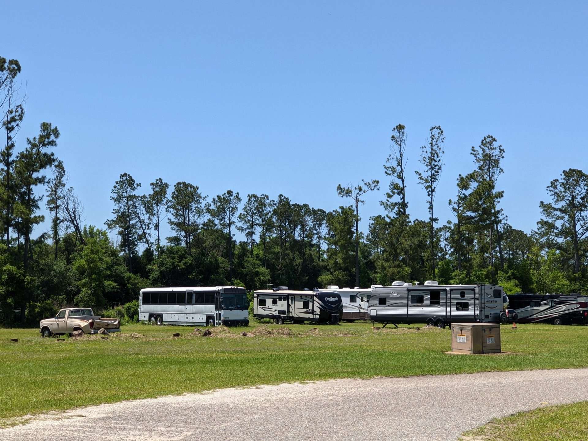 RVs parked together at campsite.
