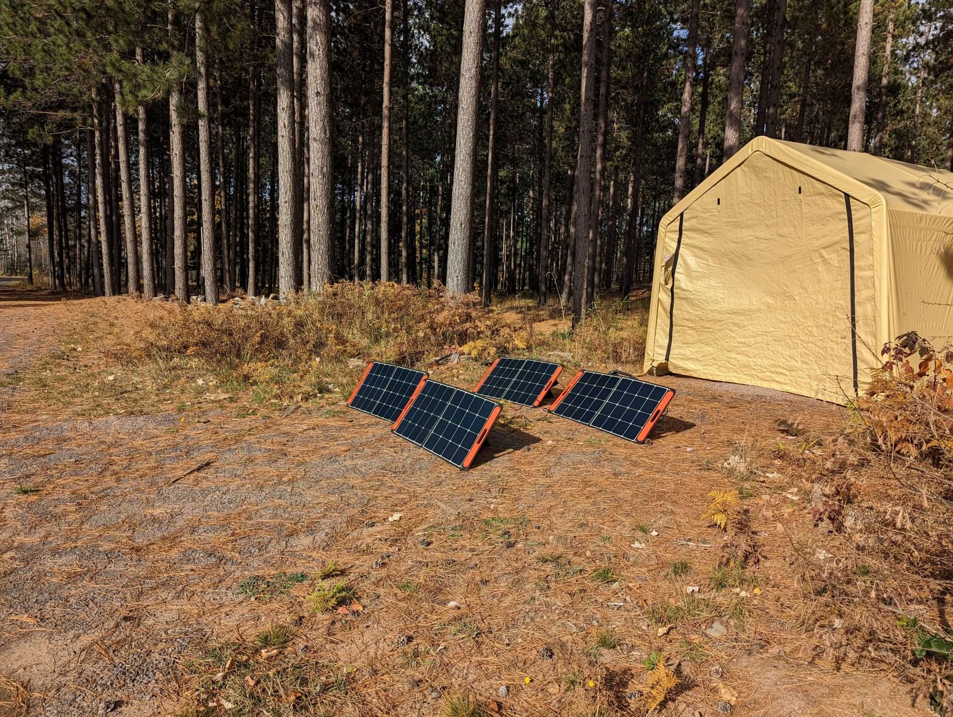 Harbor Freight Portable Garage installed at campsite with solar panels