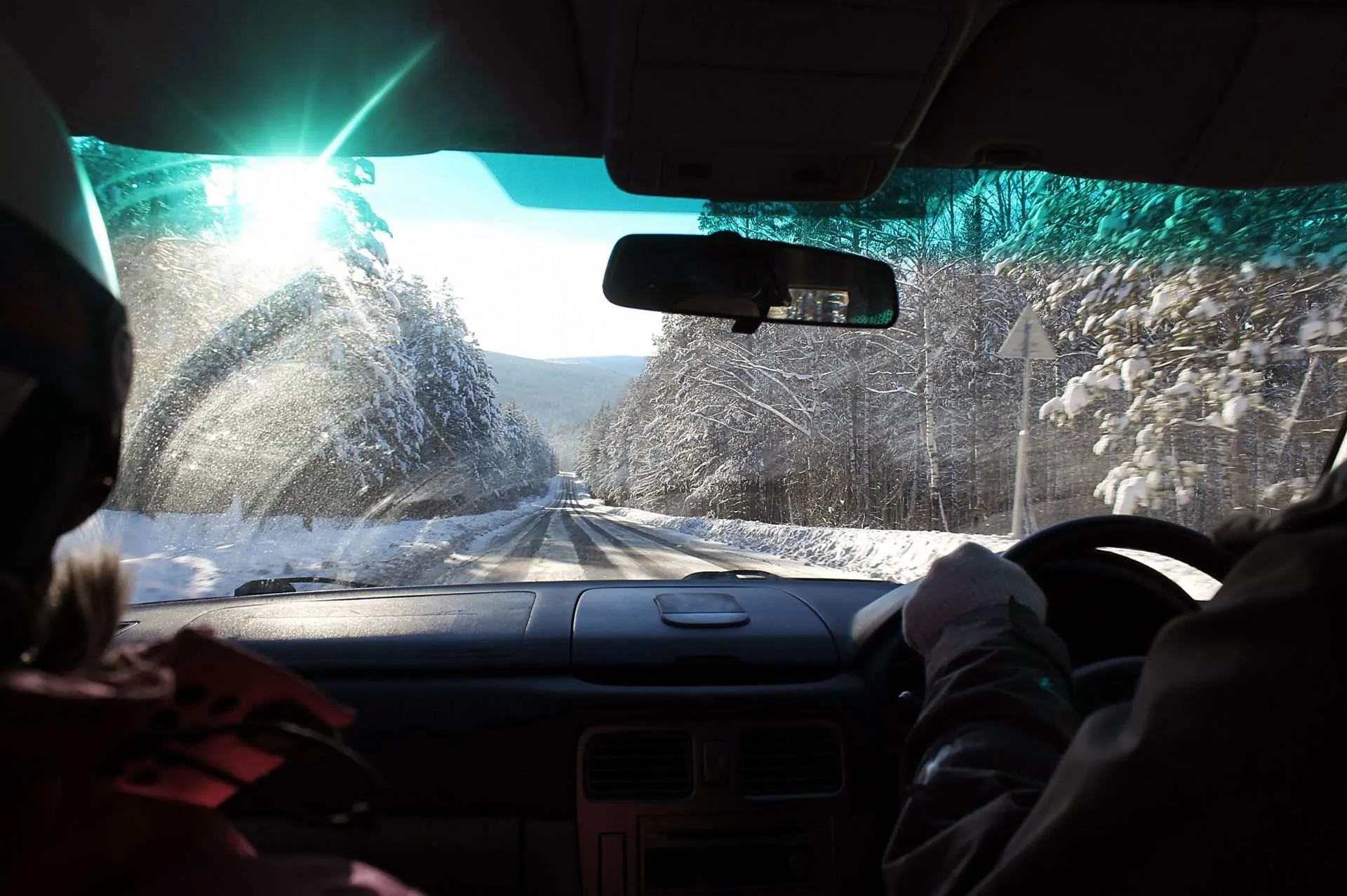Car driving on icy road in winter