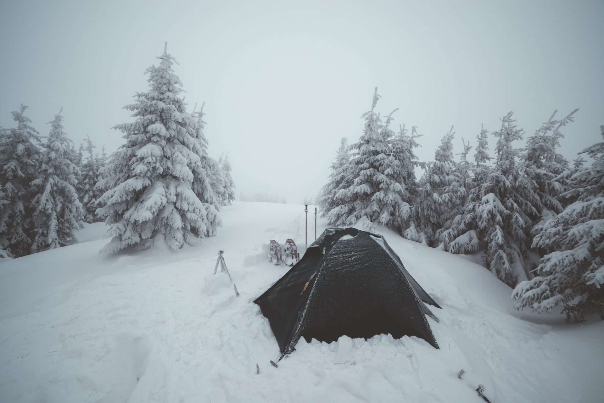 Tent surrounded in snow