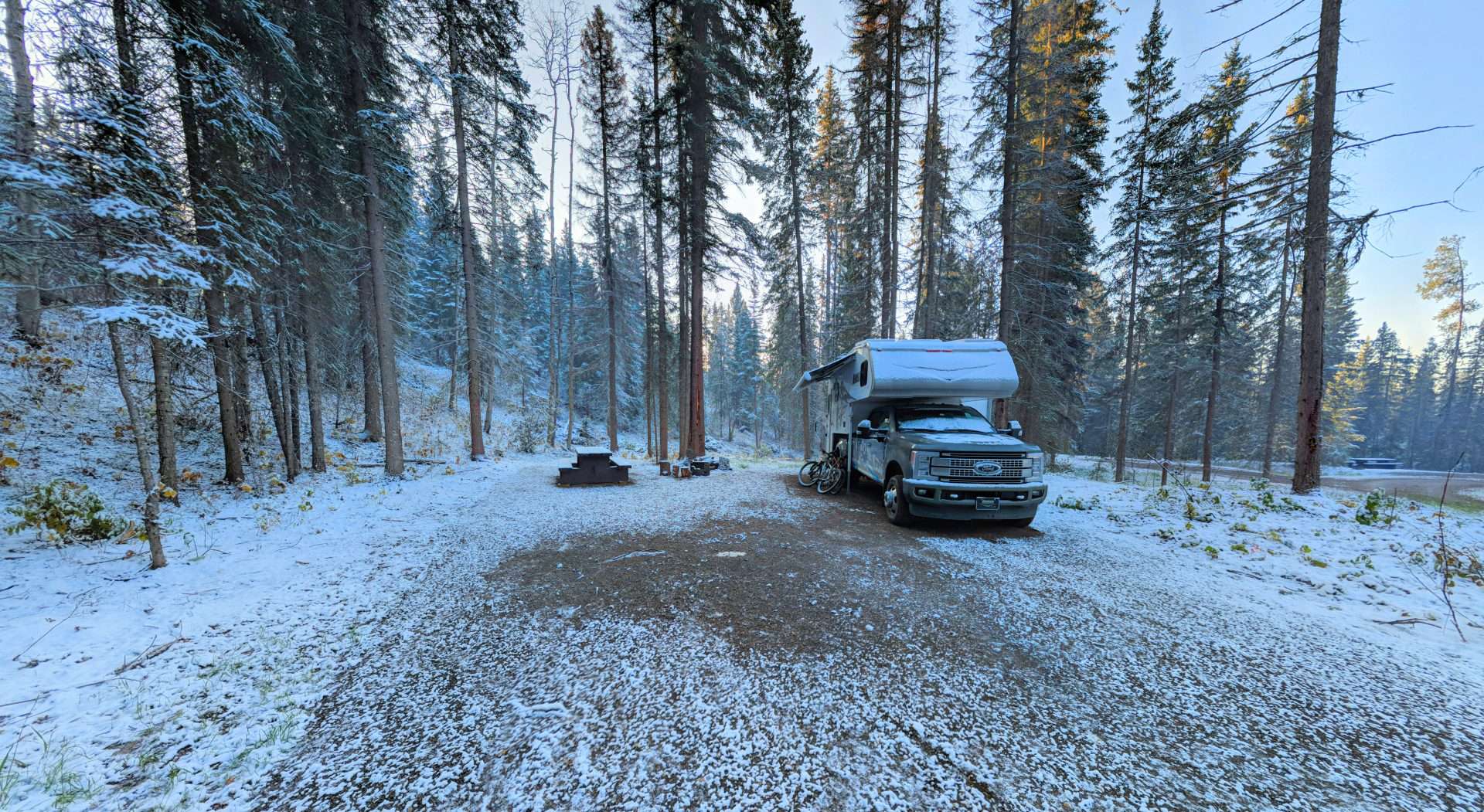 Truck camper in snowy campsite