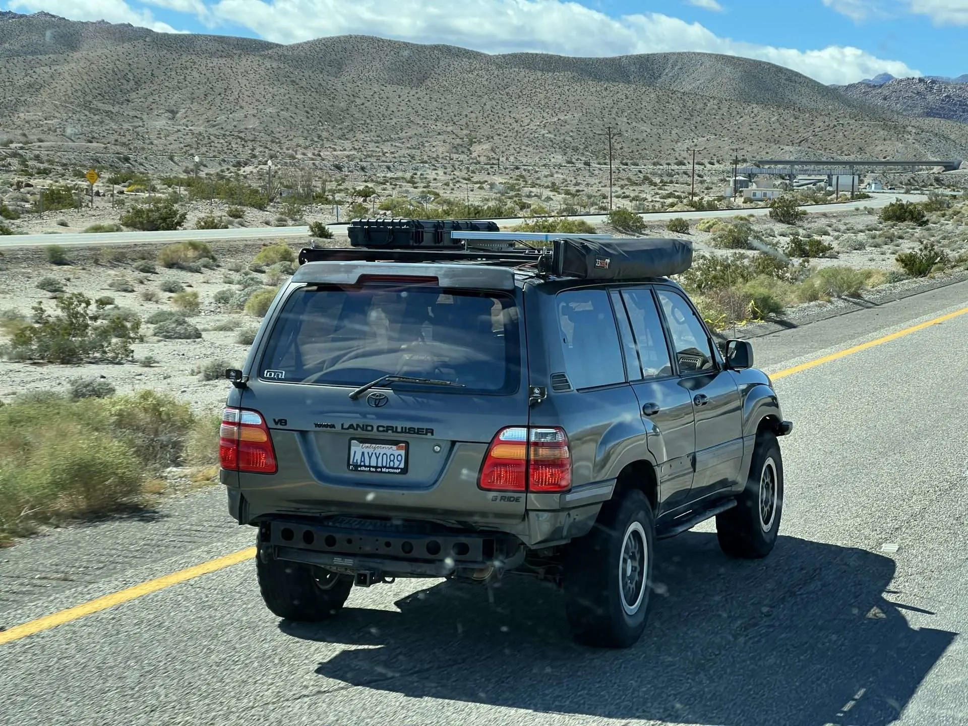 Overland vehicle driving with roof rack