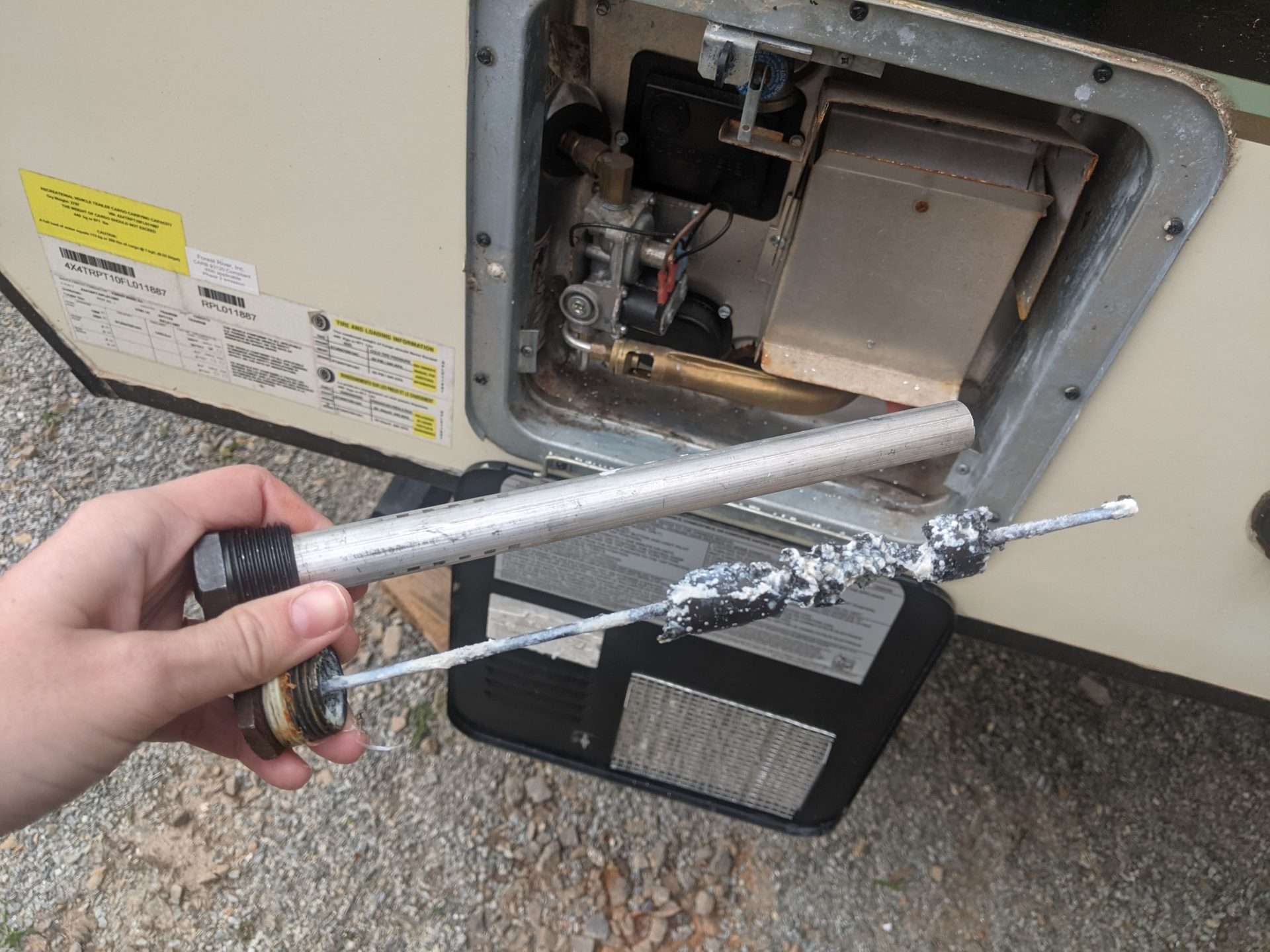 new and old RV water heater anode rods