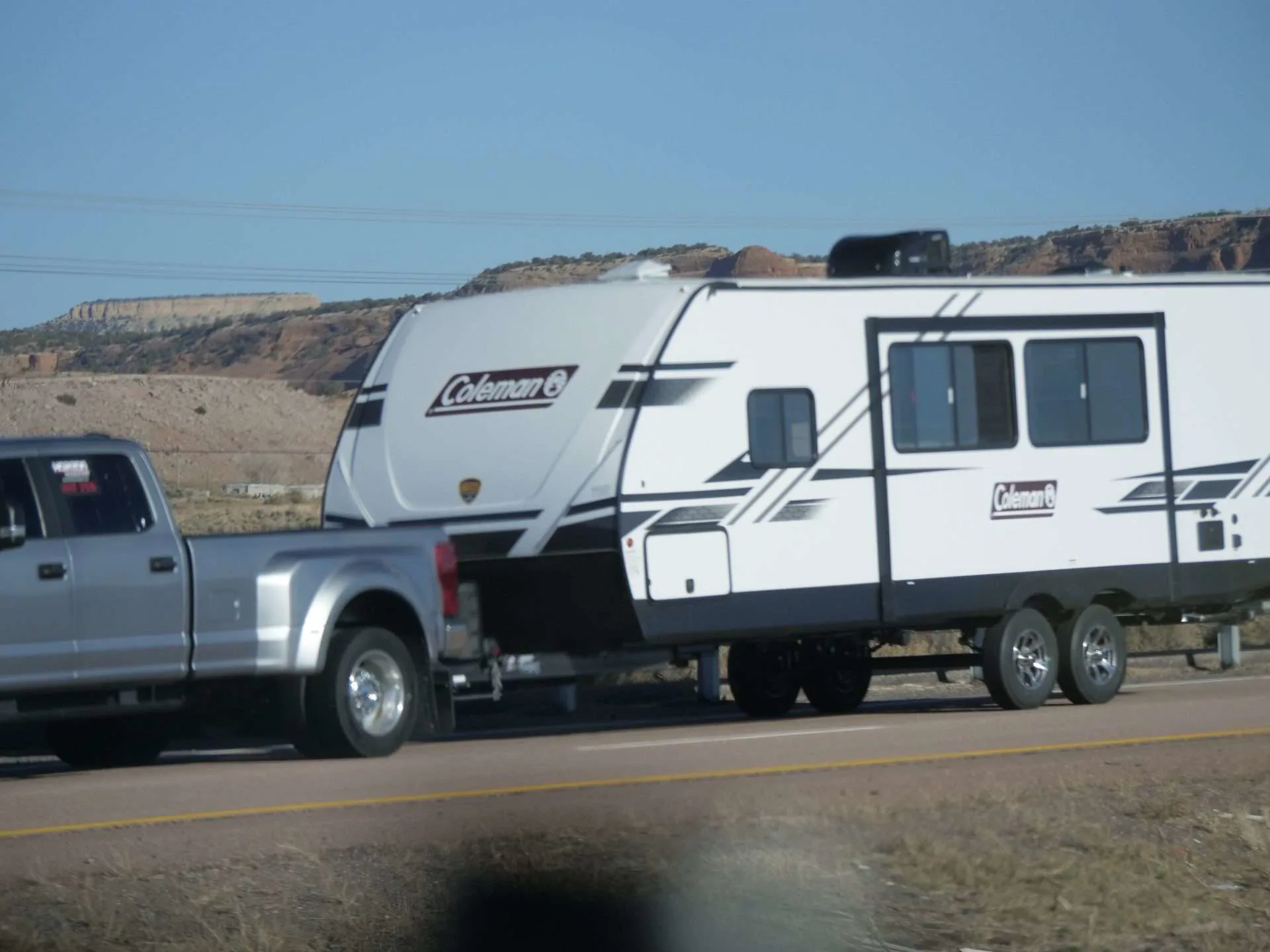 Truck towing Coleman camper