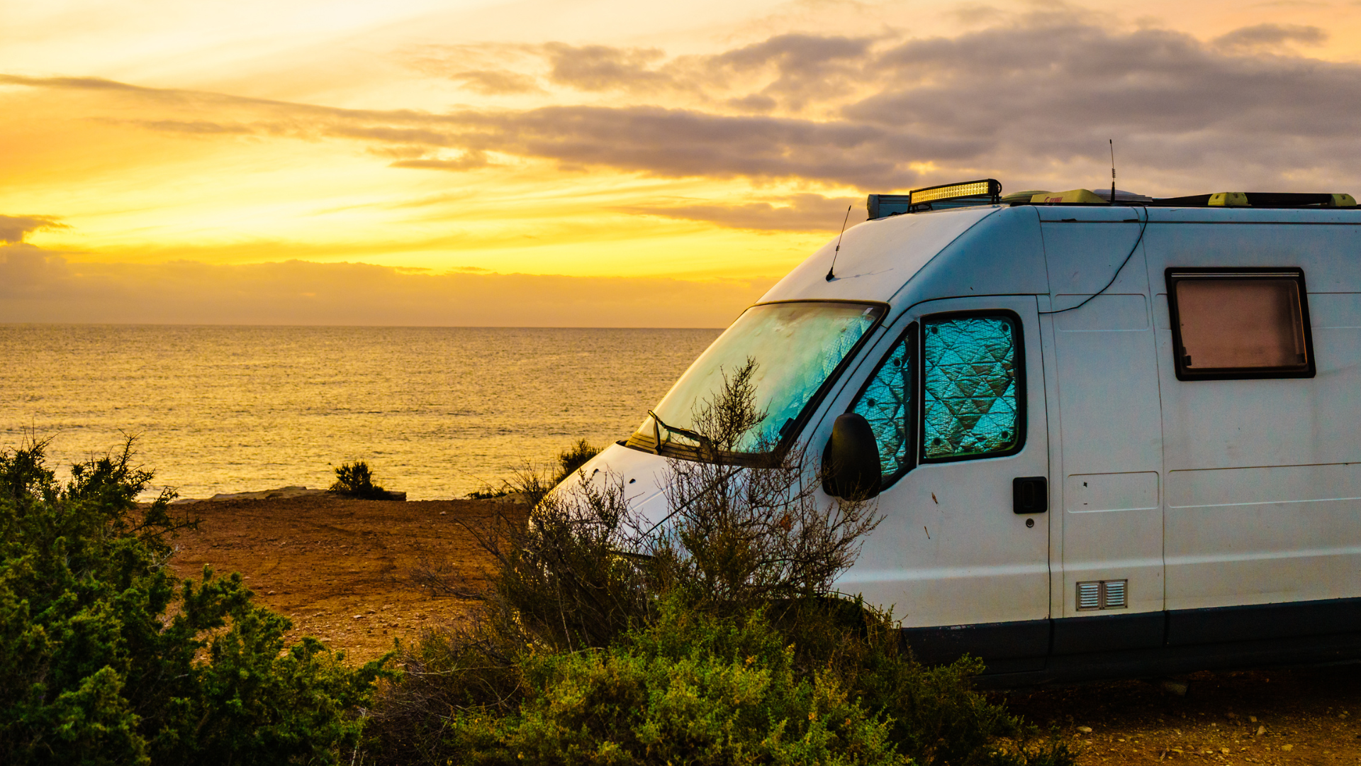 Campervan parked at sunset