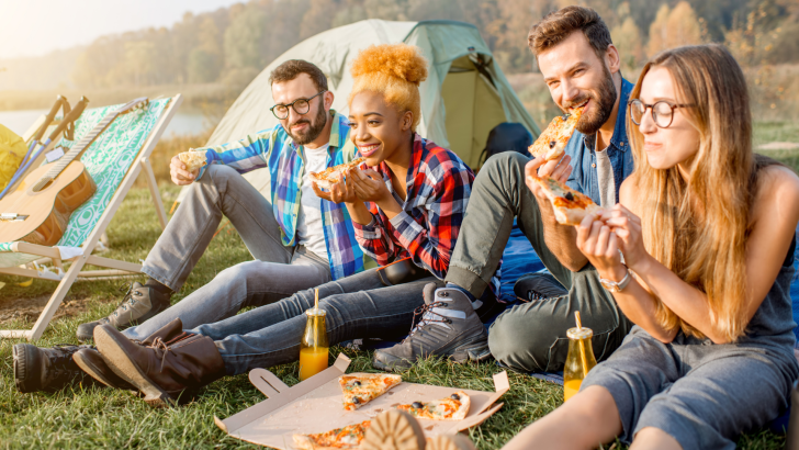 Eating pizza while camping