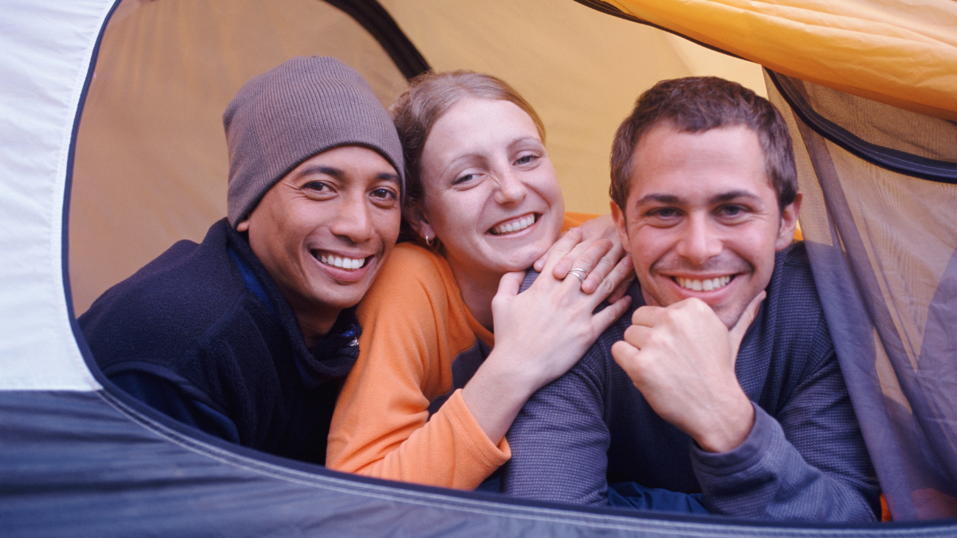 Three people in big tent
