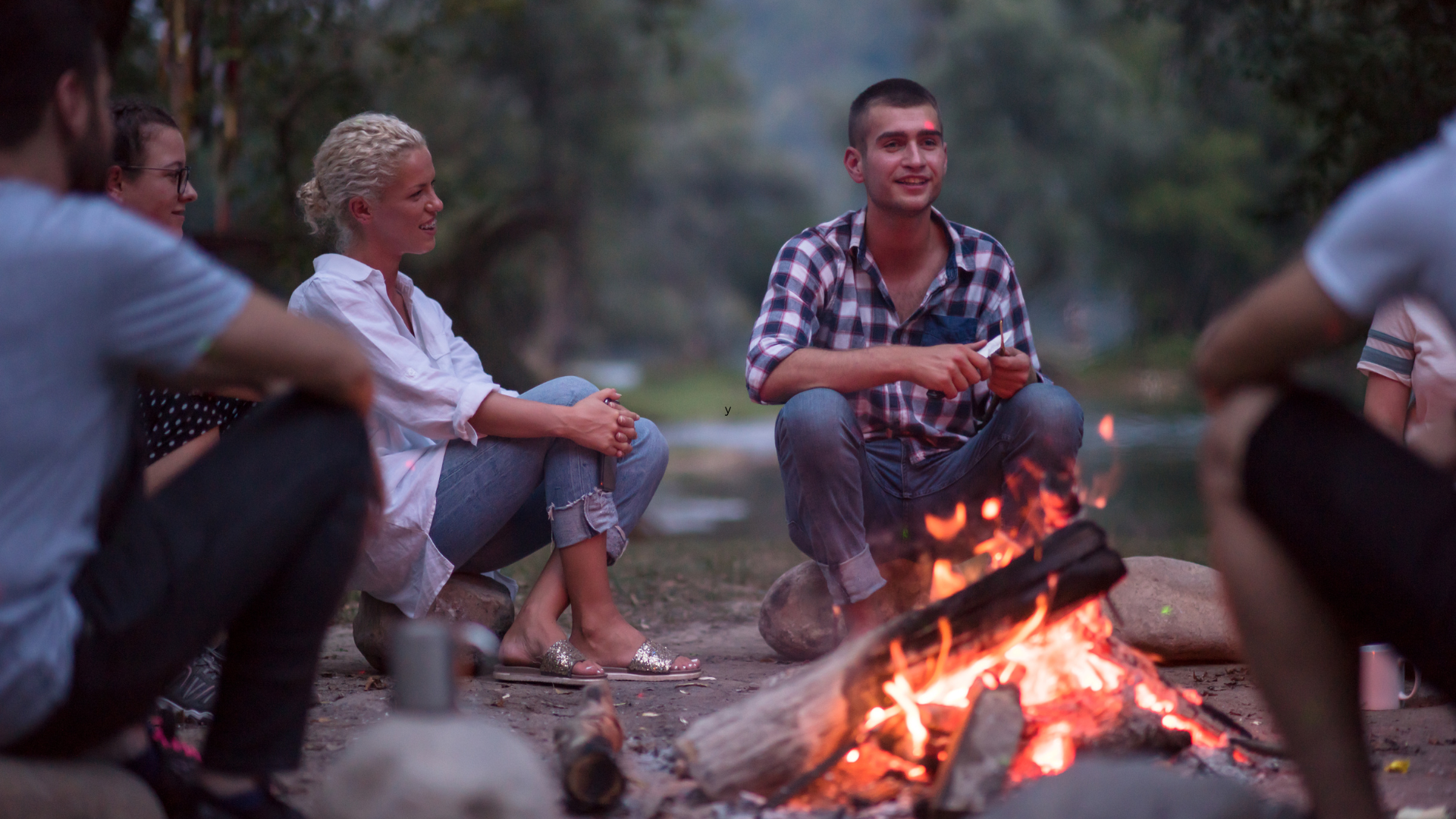 Adults playing campfire game