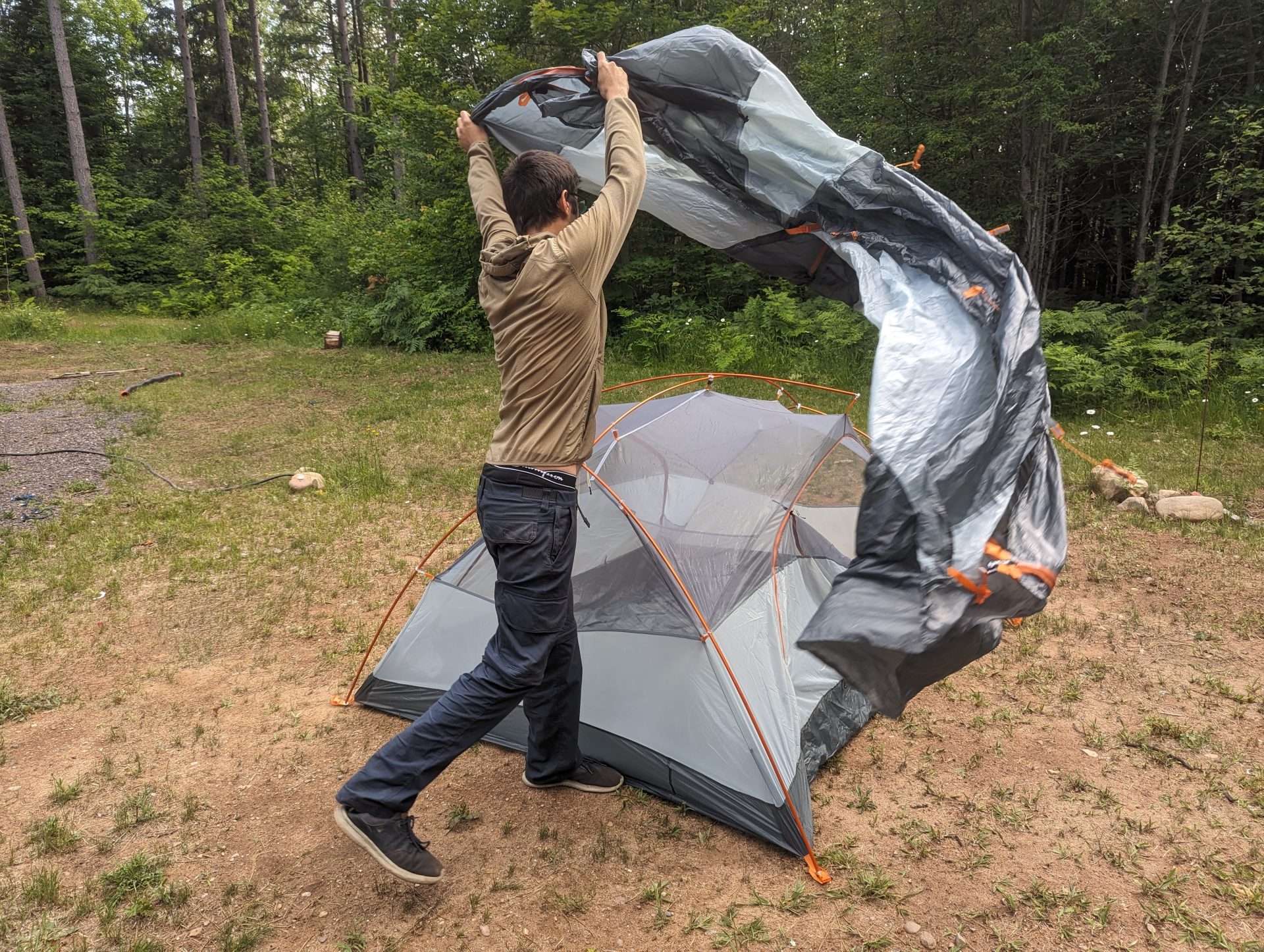 installing a rainfly on a backpacking tent 
