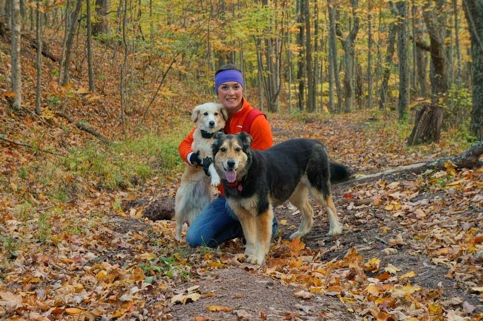 cait morton hiking with dogs in fall colors
