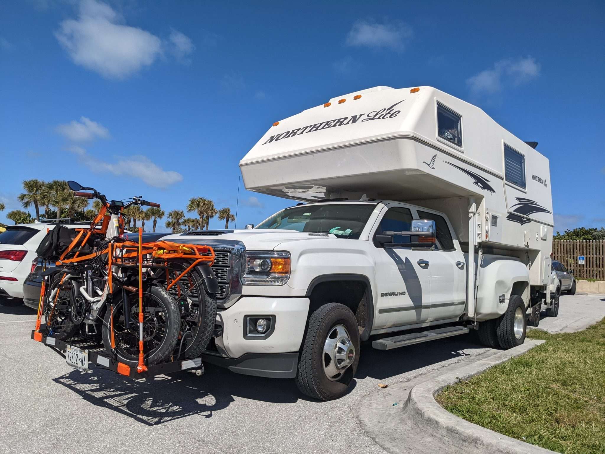 Truck camper with front hitch receiver